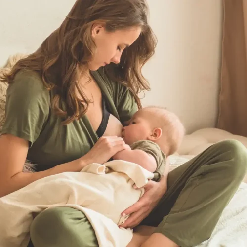The concept of breastfeeding. Portrait of mom and breastfeeding baby.
