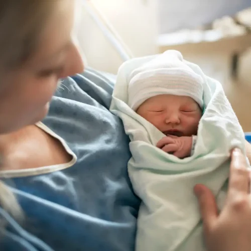 A Mother with her newborn baby at the hospital a day after a natural birth labor